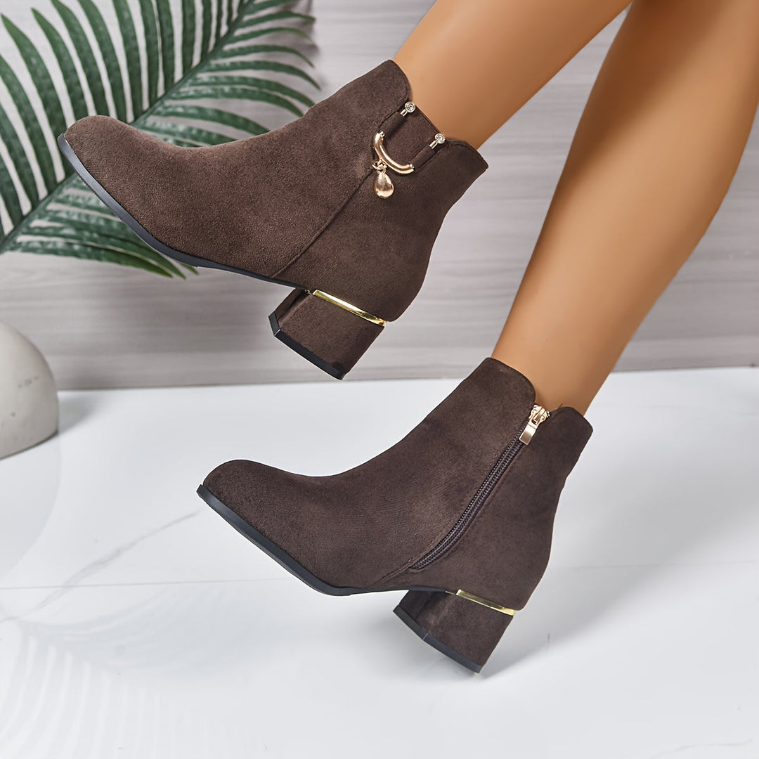 Stylish women's brown Chelsea ankle boots featuring elastic goring, a pull tab, & comfortable block heel.