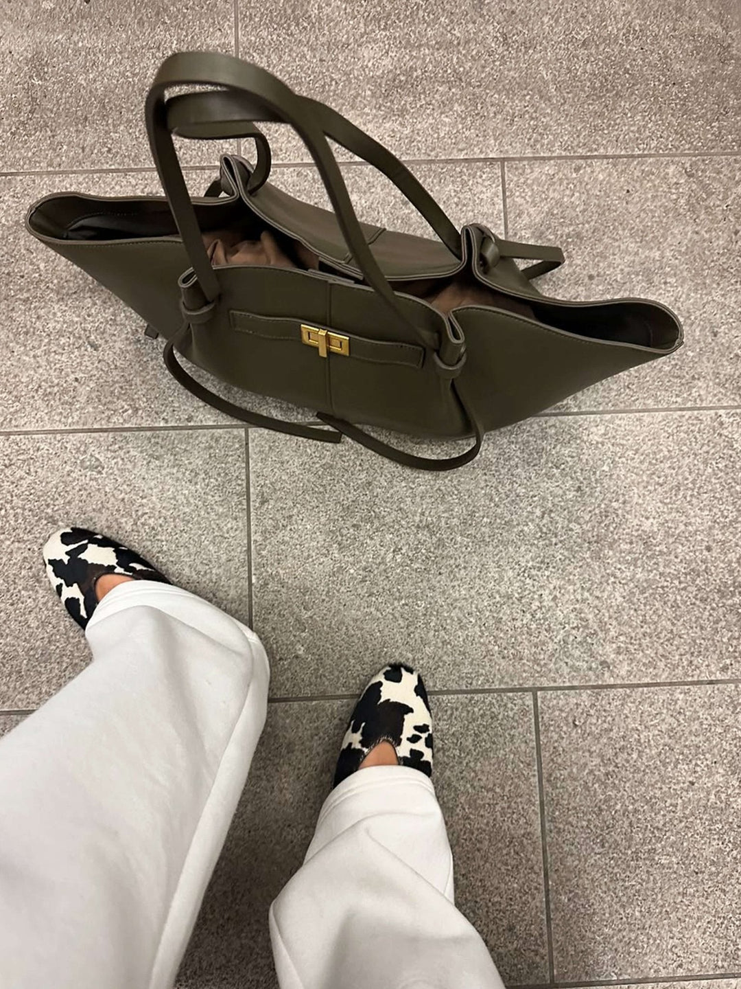 Women's Verona Structured Bag held by hand, demonstrating its comfortable and chic handbag style.