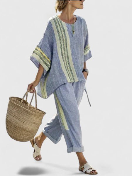 Effortless women's oversized two-piece set. Relaxed fit top & wide-leg pants for a chic, comfortable casual outfit.