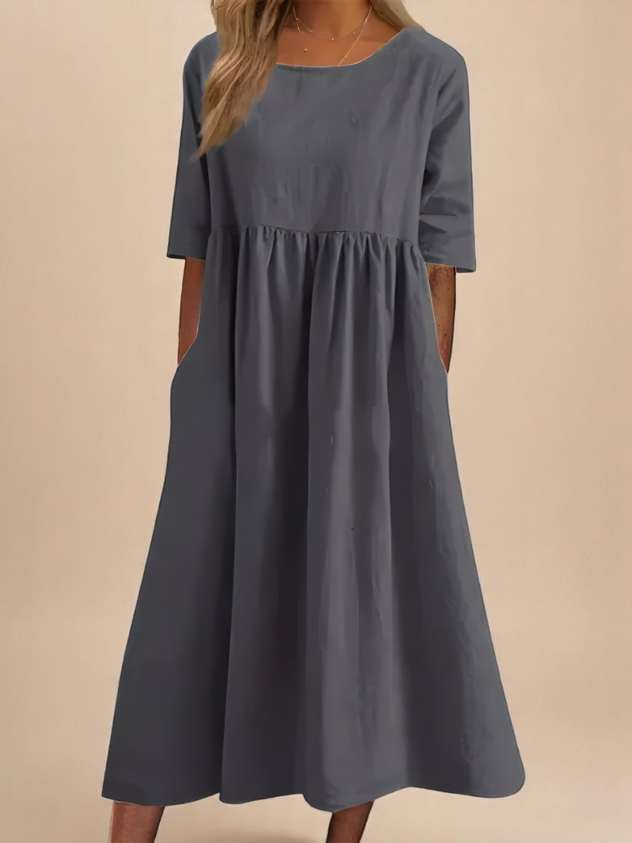 Comfortable women's mid-sleeve dress in a relaxed fit, ideal for versatile spring and summer styling.