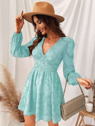 Sophisticated women's cocktail dress, featuring stylish puff sleeves and a modern V-neck, a chic short party dress.
