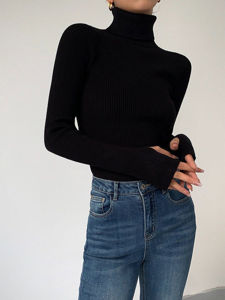Stylish women's ribbed turtleneck, a cozy and versatile knitwear piece for elegant autumn fashion.