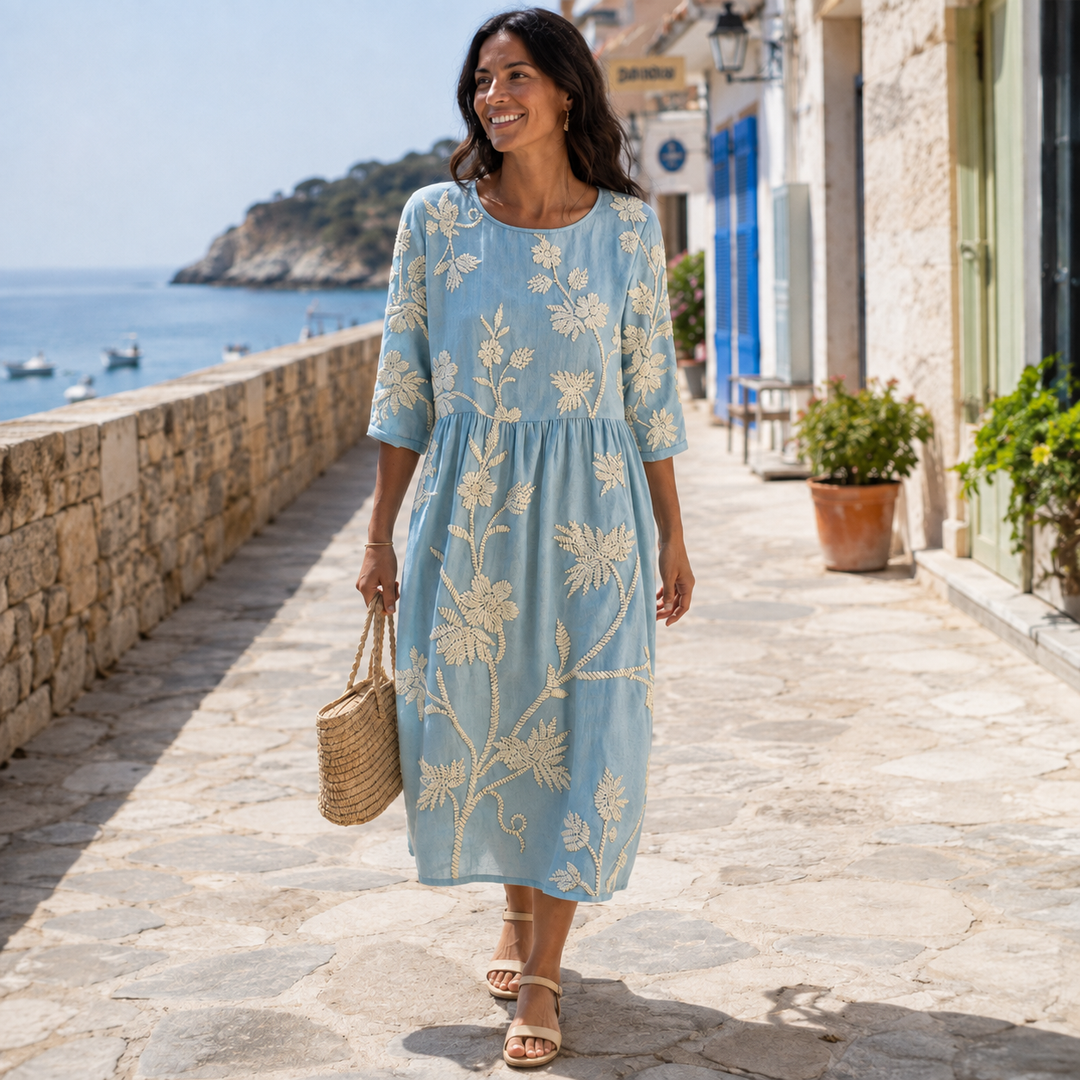 Elegant women's floral midi dress, a stylish round neck summer outfit for casual wear or occasions.