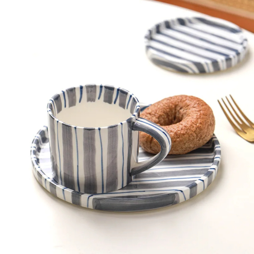 Vintage style hand-painted ceramic cup & saucer set, an elegant gift for coffee lovers or kitchen decor.