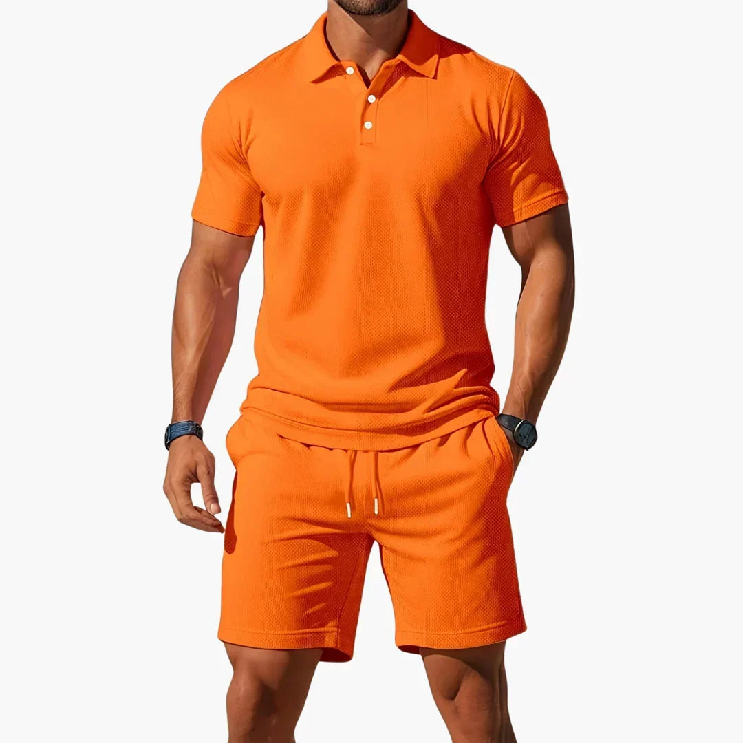 Stylish men's coordinated summer outfit featuring a comfortable polo and elegant shorts. Perfect for warm days.