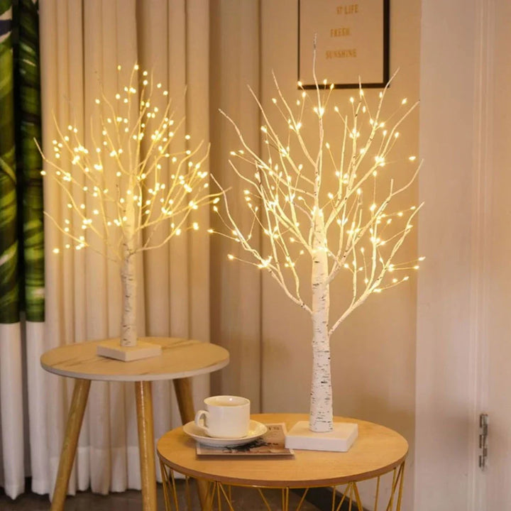 Battery-operated Nordic birch tree light with flexible branches & warm white LEDs for versatile home decor.