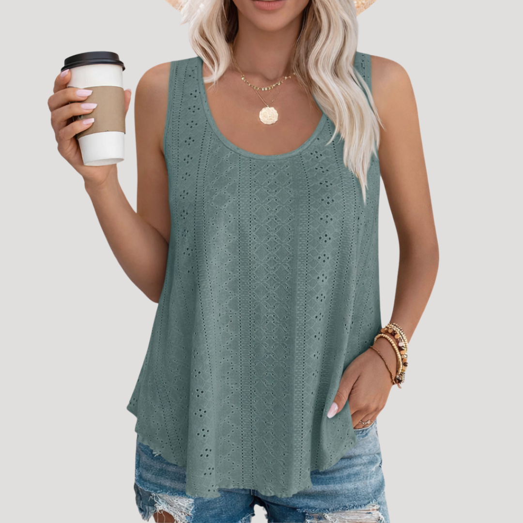 Model wearing a comfortable, relaxed fit Women's Fenella eyelet tank top, ideal for warm weather and summer.
