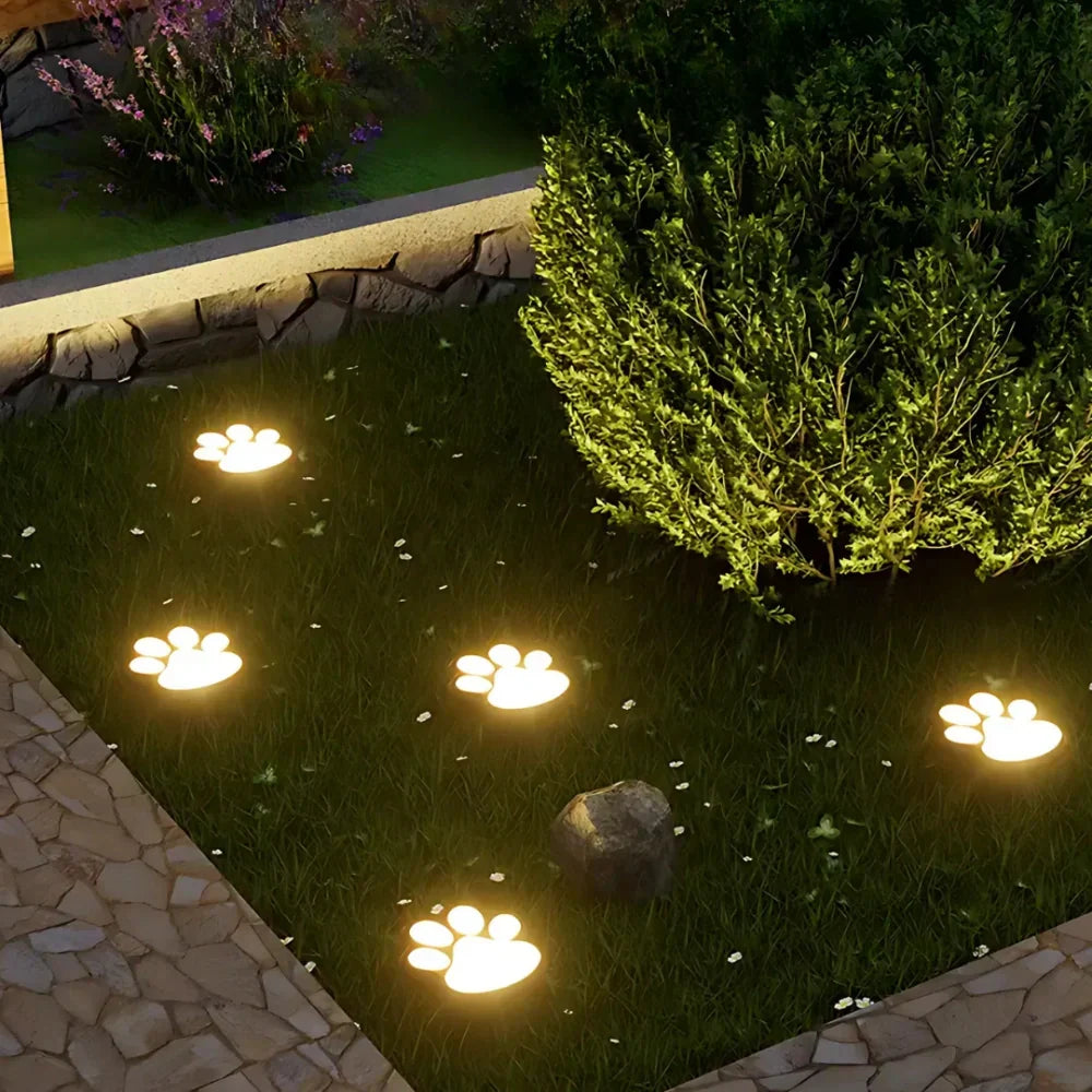 Whimsical paw print solar path lights, waterproof LED for garden & yard decor.