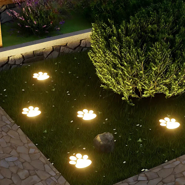 Whimsical paw print solar path lights, waterproof LED for garden & yard decor.