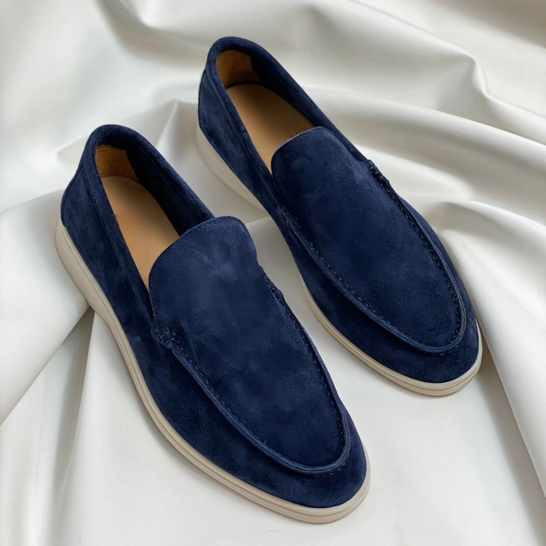Classic black men's loafers, comfortable slip-on shoes for versatile everyday wear and elegant formal occasions.
