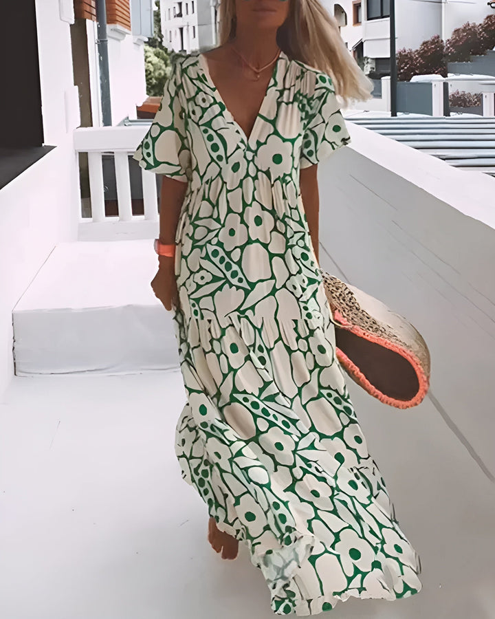 Woman in a flowy lightweight short-sleeve summer maxi dress, perfect for beach vacations.