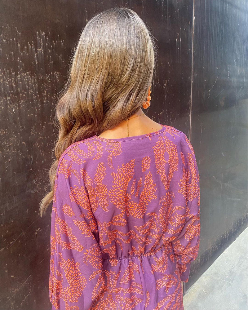 Women's elegant boho wrap dress, a flowing maxi style that is both casual and chic for summer vacation.