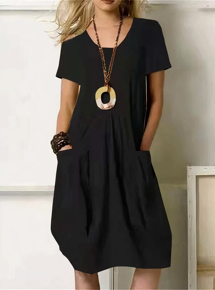 Versatile black women's casual dress. Comfortable, relaxed fit with a flattering silhouette for effortless everyday style.