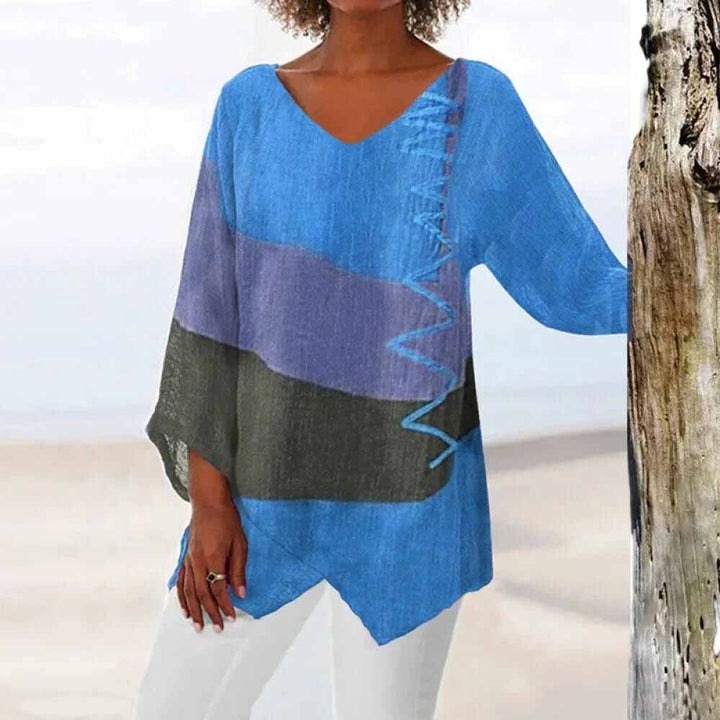 Colorful tricolor women's blouse. Sophisticated long-sleeve v-neck top for elegant ladies' modern fashion.