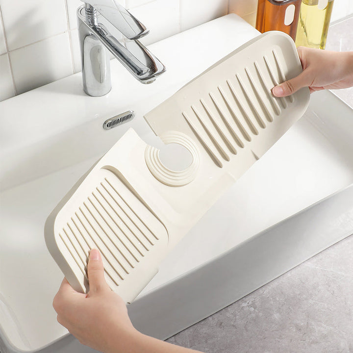 Heat resistant silicone drainer mat for dishes & glasses, with a smart self-draining design.