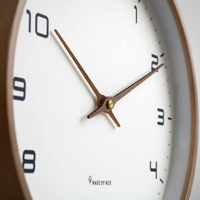 Stylish minimalist wall clock. Scandinavian design, silent operation for contemporary home or office decor.