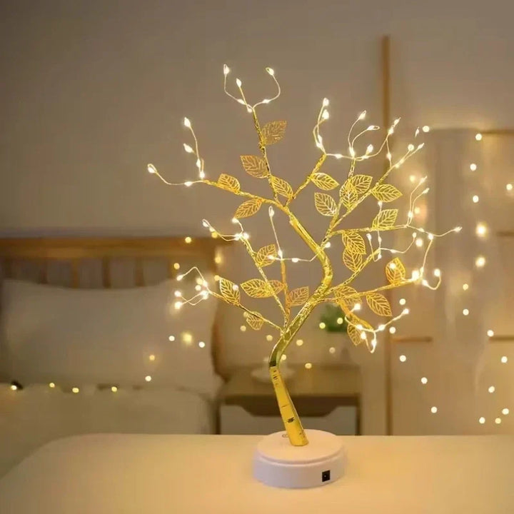 Decorative LED golden leaf bonsai tree lamp, casting warm white light to enhance your home's ambient lighting.