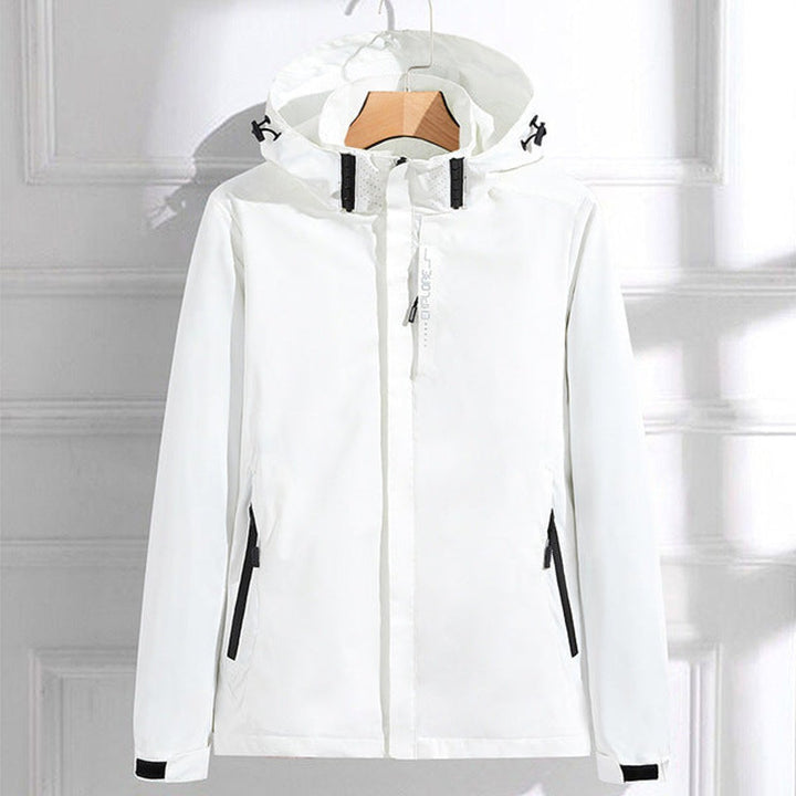 Lightweight women's waterproof raincoat with adjustable hood, offering weatherproof protection for all outdoor adventures.