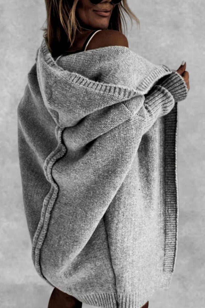 Oversized women's hooded knit cardigan, a comfortable and casual piece for winter style.