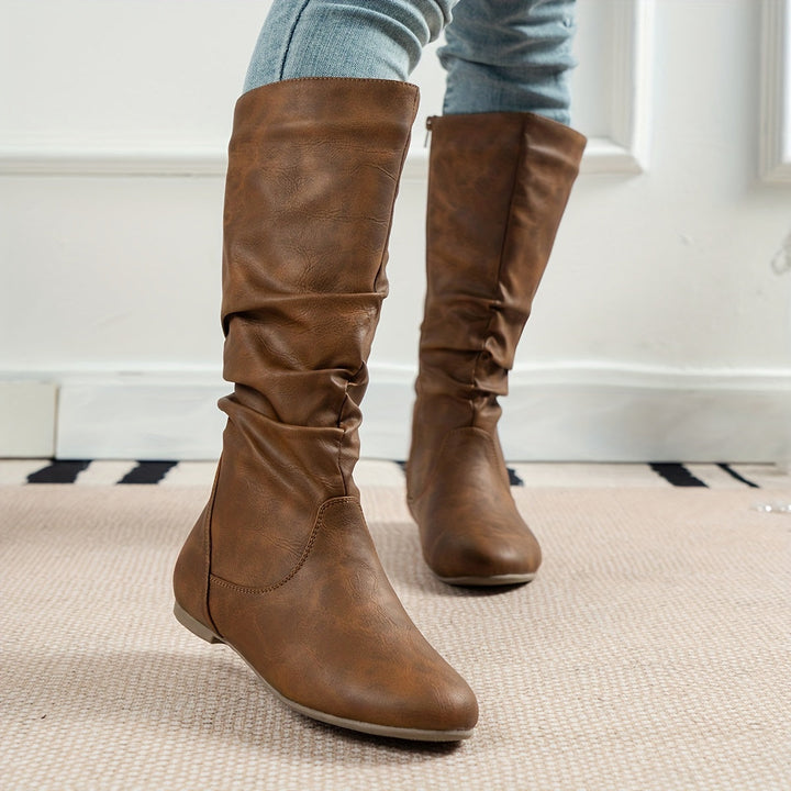 Brown women's gathered flat knee-high boots with side zip, ideal for comfortable fall fashion.