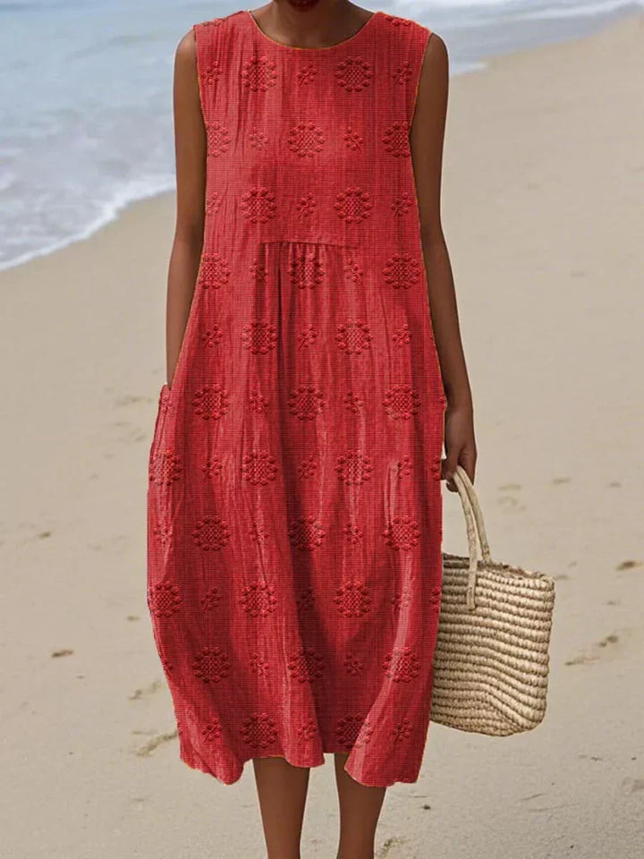 Lightweight, comfortable women's summer midi dress with elegant embroidery and practical pockets for daily wear.