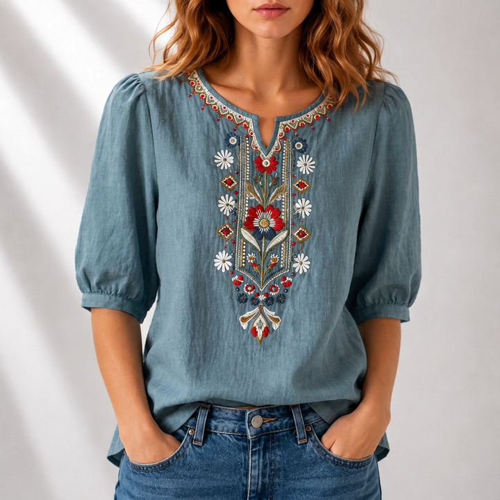 Floral embroidered women's top, elegant design & relaxed fit. Ideal for spring fashion & comfortable style.
