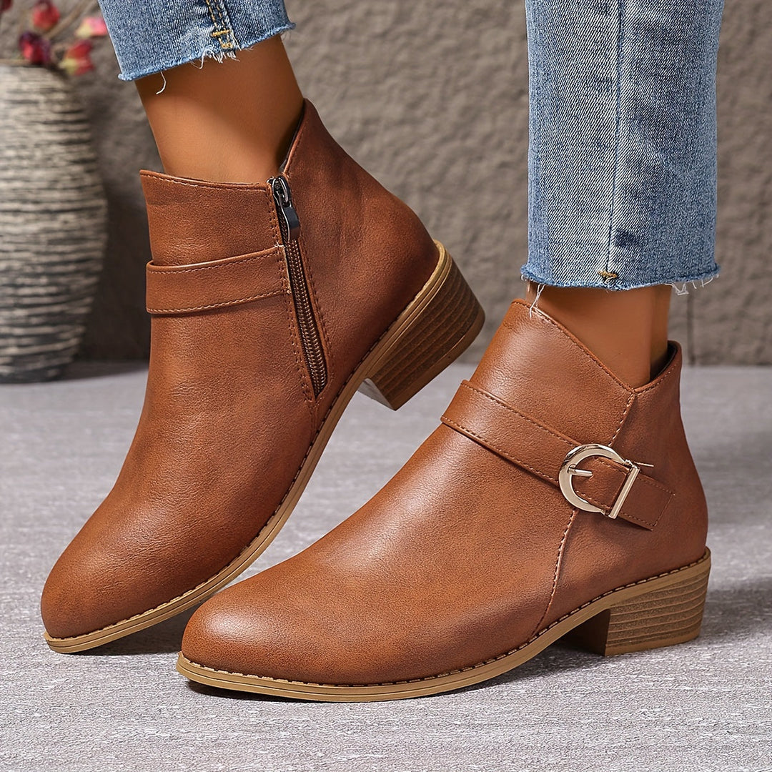 Green women's Chelsea ankle boots with sleek modern buckle, side zip, and sturdy block heel.