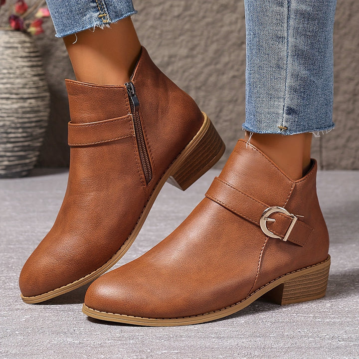 Green women's Chelsea ankle boots with sleek modern buckle, side zip, and sturdy block heel.