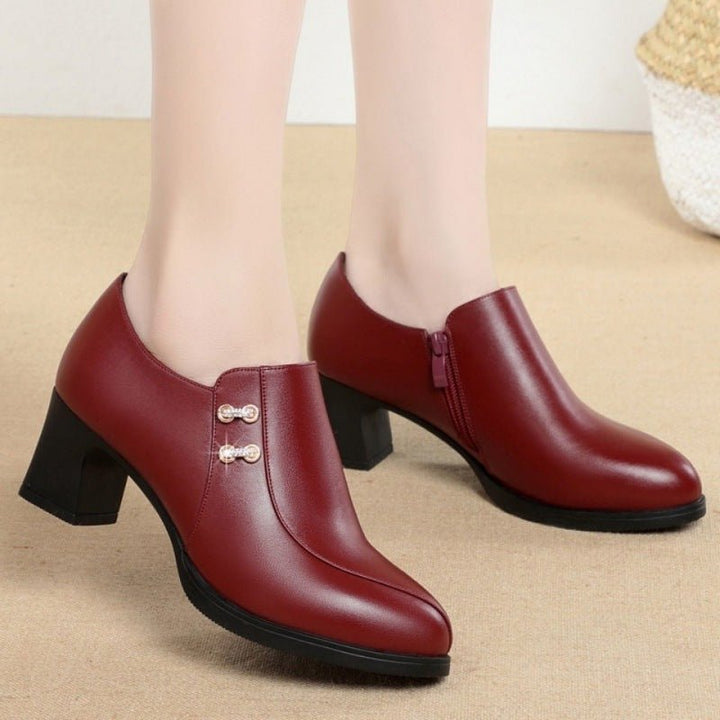 Versatile women's leather ankle boots with side zipper, block heel, and rounded toe for fall winter fashion.