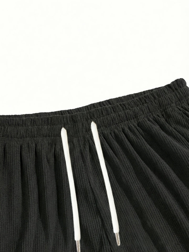 Easy style dark green men's drawstring shorts, relaxed fit for casual summer days.