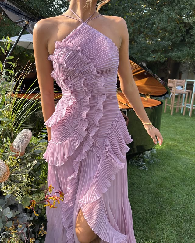 Chic lavender women's maxi dress featuring ruffles and a halter neck, suitable for elegant formal events.