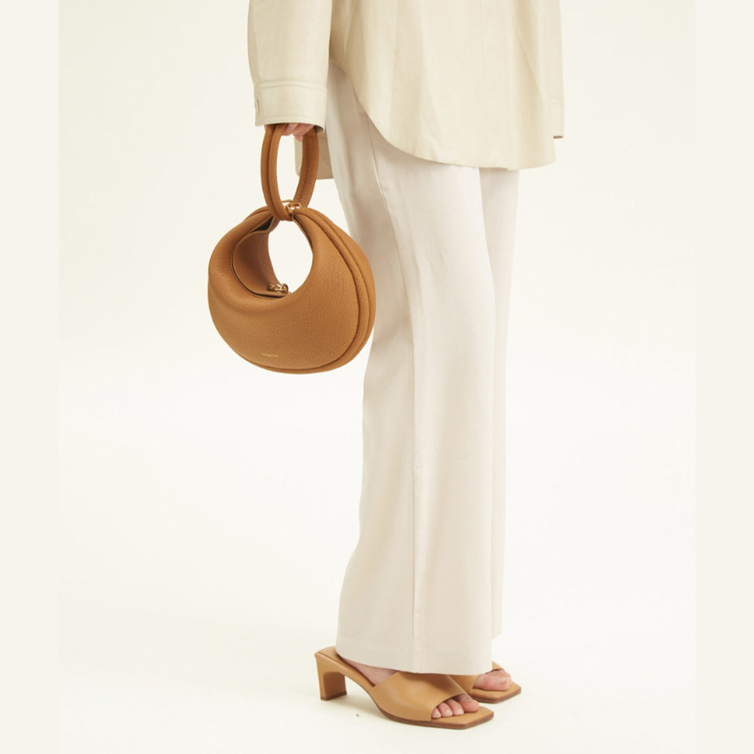 Limited edition petal pink full-grain leather shoulder bag, women's elegant accessory.