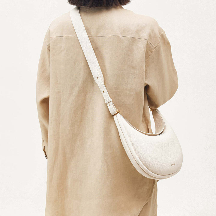 Petal pink full-grain leather women's crossbody bag, perfect versatile everyday luxury.