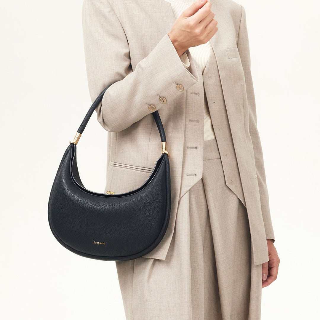 Classic black full-grain leather women's accessory, a versatile everyday shoulder bag.