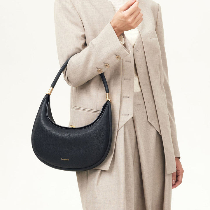 Classic black full-grain leather women's accessory, a versatile everyday shoulder bag.