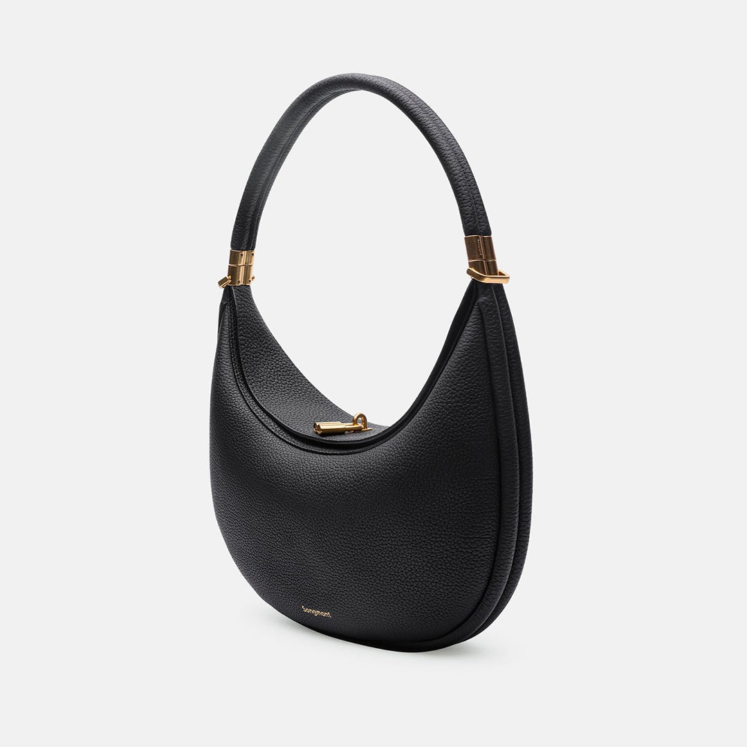 Classic black full-grain leather shoulder bag, versatile luxury handbag for women.
