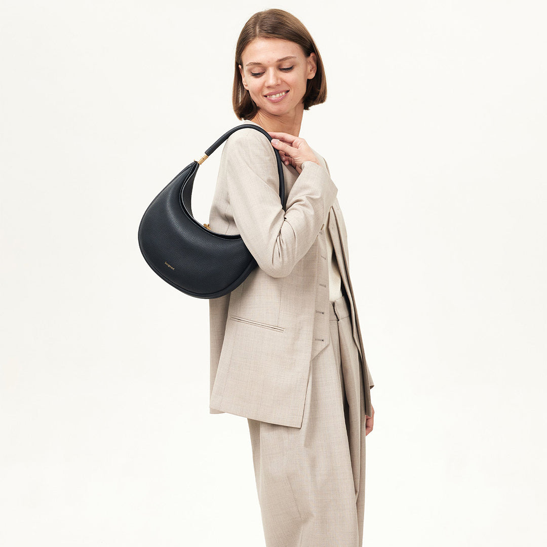 High-quality petal pink full-grain leather women's shoulder bag, a versatile luxury handbag.