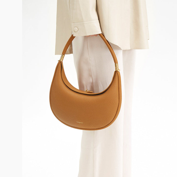 Pure ivory full-grain leather luxury shoulder bag, elegant everyday accessory for women.