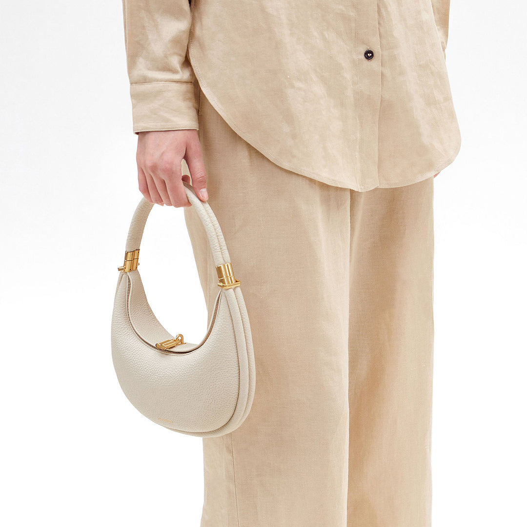 Timeless pure ivory full-grain leather women's shoulder bag, an elegant & versatile accessory.