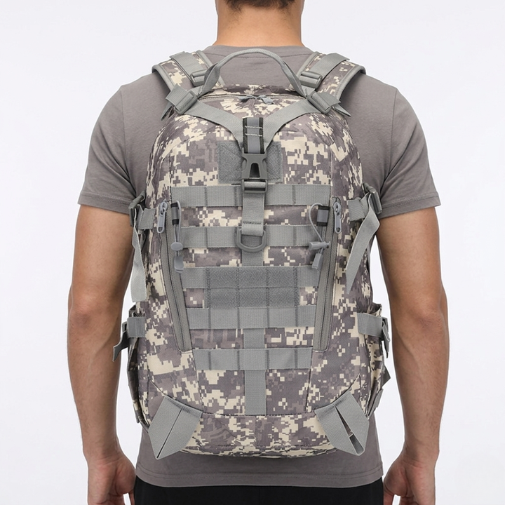 Close-up: water-resistant fabric on a 40L tactical outdoor backpack, ready for any adventure.