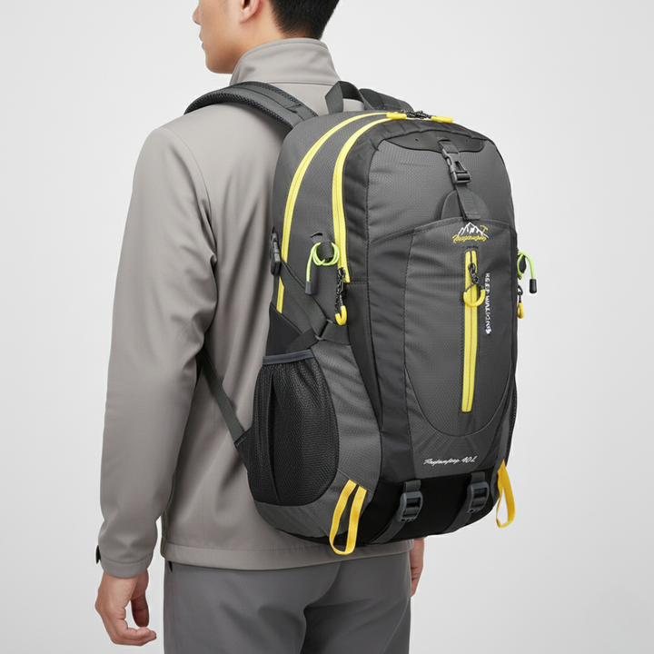 Back view of a comfortable 40L water resistant adventure backpack with padded straps for hiking and travel gear.