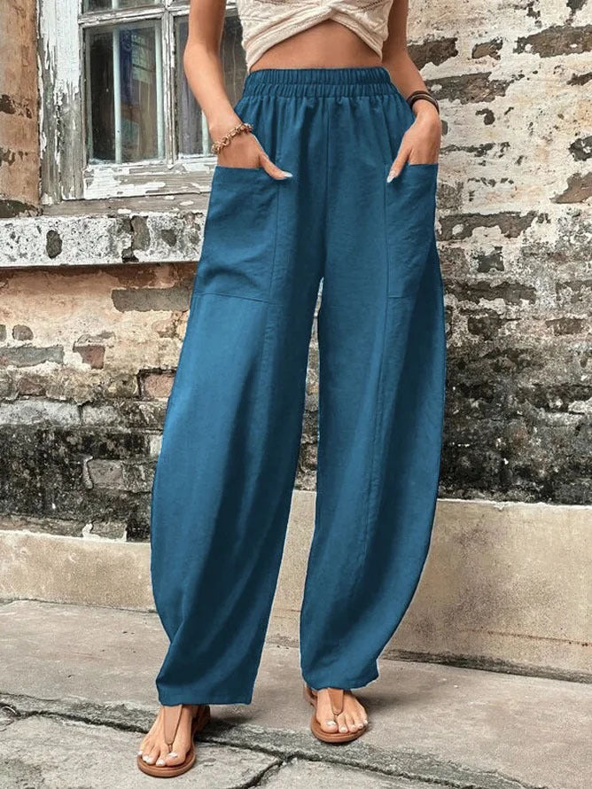 Relaxed fit women's wide-leg palazzo pants with functional pockets, ideal for comfortable daily wear.
