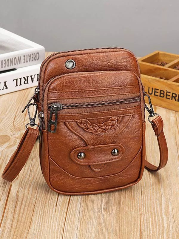 Women's vintage genuine leather crossbody bag, stylish and durable for everyday use.