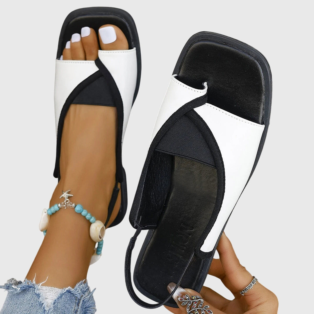 Stylish women's square-toe flat sandals, perfect for summer comfort. Easy slip-on design for casual wear.