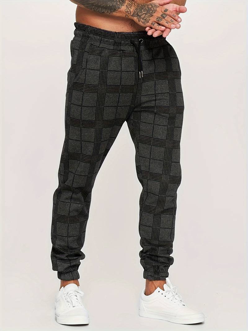 Sporty men's checked joggers with a relaxed fit, offering everyday comfort and modern casual style.
