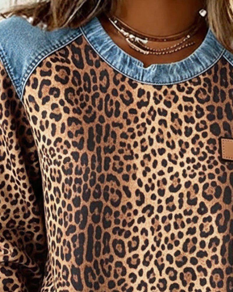 Chic women's leopard print knit sweater for a trendy casual fall or winter look. Comfortable long-sleeve pullover.