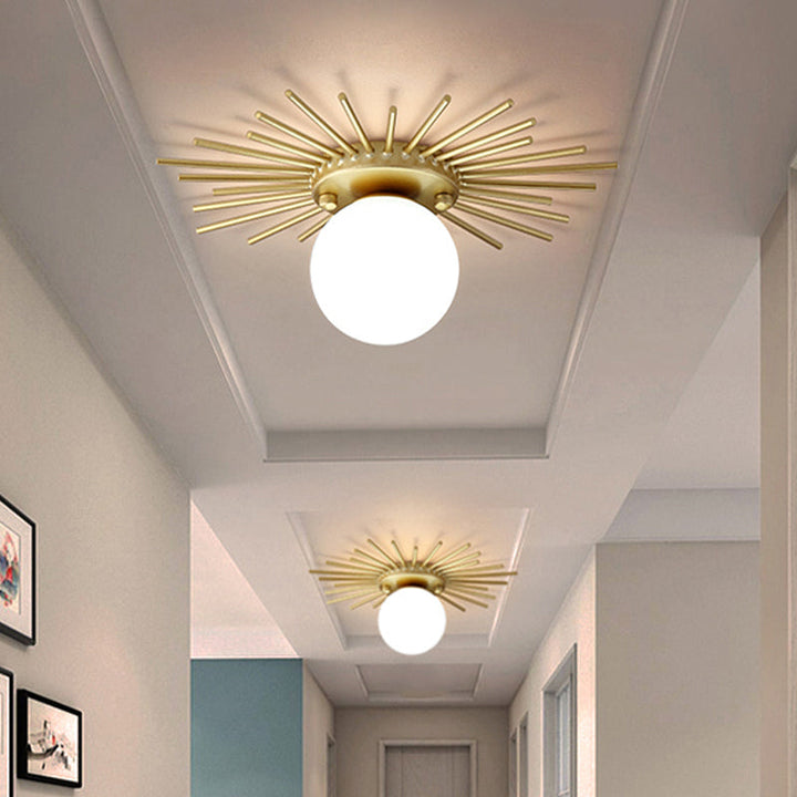Modern gold spherical ceiling lamp with frosted glass shade, perfect for minimalist home decor.
