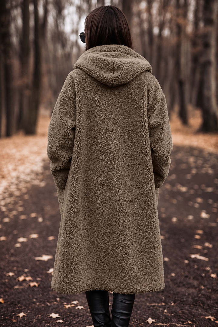 Ladies hooded cozy coat, knee-length & warm for elegant winter outerwear layering.