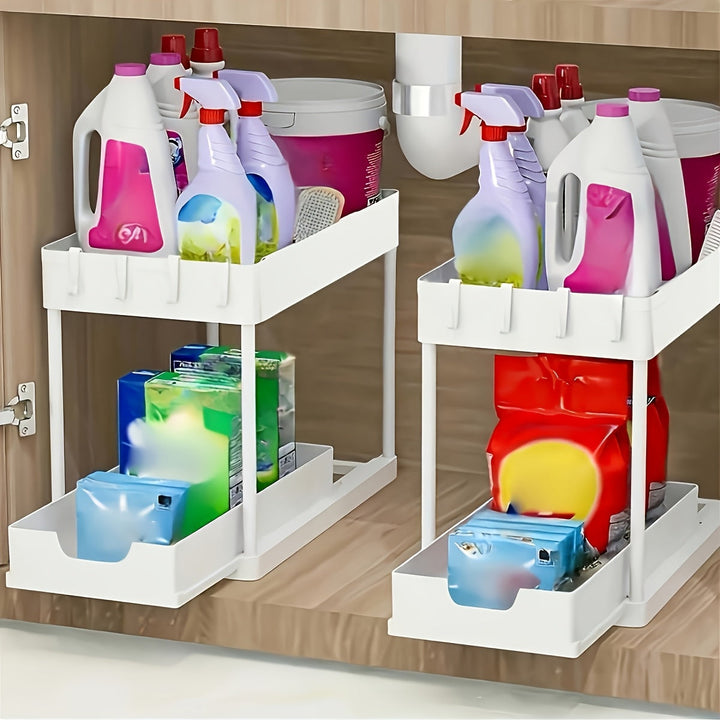 Space-saving 2-tier utility organizer with convenient pull-out drawers, hooks, and cup for cupboard essentials.