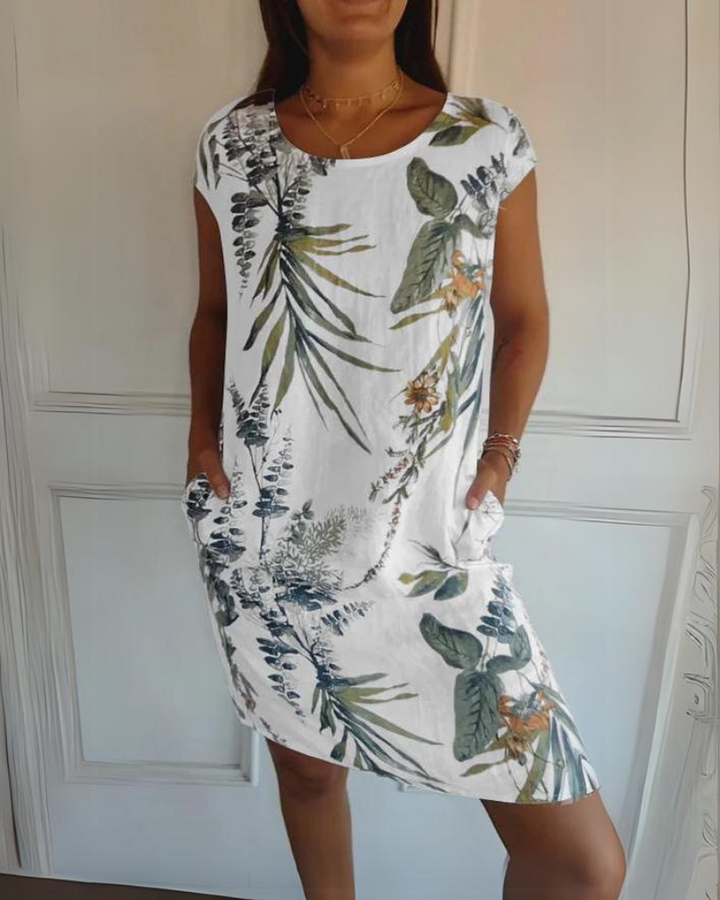 Elegant women's printed dress featuring a stylish floral design, perfect for a chic summer look or casual wear.